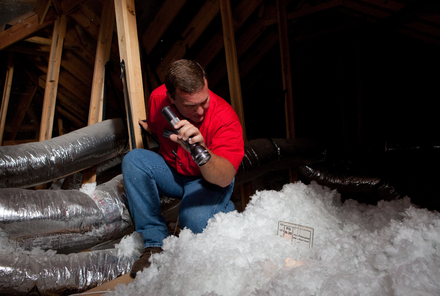 Man in attic with insulation