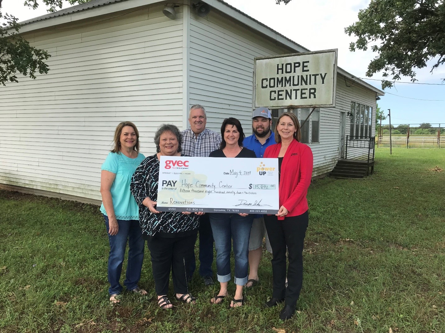 Hope Community Center board members accept a Power Up grant for $15,892.