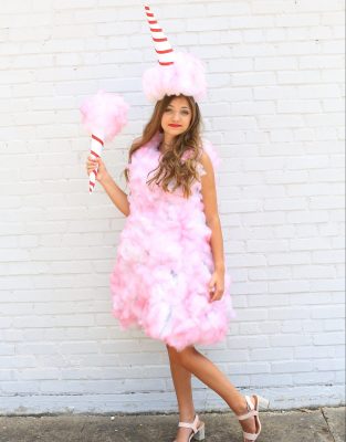 Picture of a young woman dressed in a pink cotton candy homemade Halloween Costume
