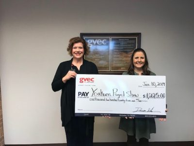 From left: Christine Presley, community relations representative with the Guadalupe Valley Electric Cooperative (GVEC), presents a $1,225.00 donation to Tammy Bennett, president of the Yoakum Stock Show Committee, Guadalupe Valley Livestock Shows