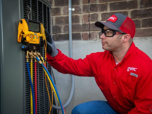 GVEC HVAC Technician Performing AC Maintenance in Cuero, TX