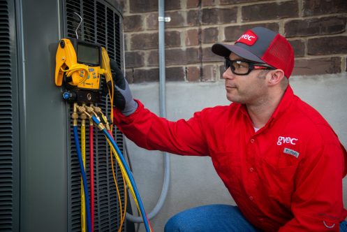 GVEC HVAC Technician Performing AC Maintenance in Cuero, TX