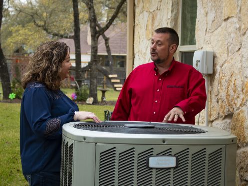 HVAC Technician Explaining Payback Program in Cuero, TX