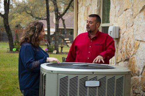 HVAC Technician Explaining Payback Program in Cuero, TX