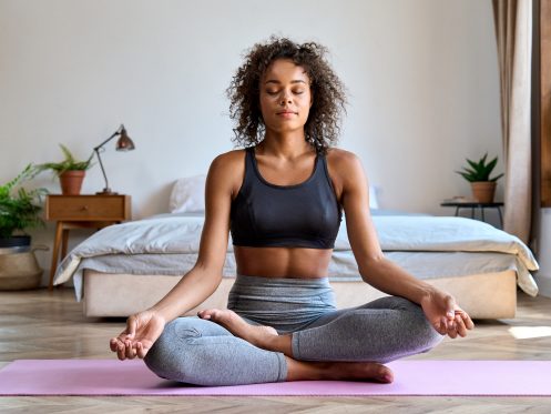 woman doing yoga inside here home can breath easy with indoor air quality products