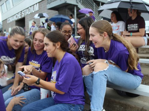 Group of girls looking at a phone