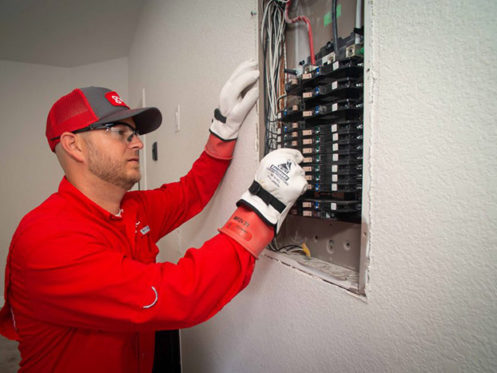 GVEC Electrician Repairing Panel in Cuero, TX