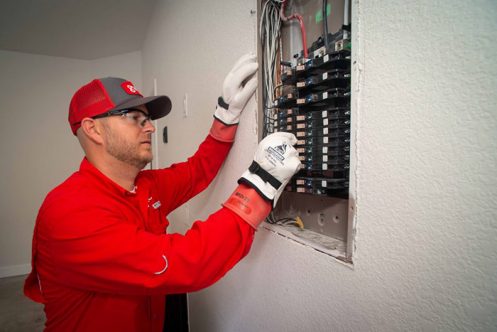 GVEC Electrician Repairing Panel in Cuero, TX